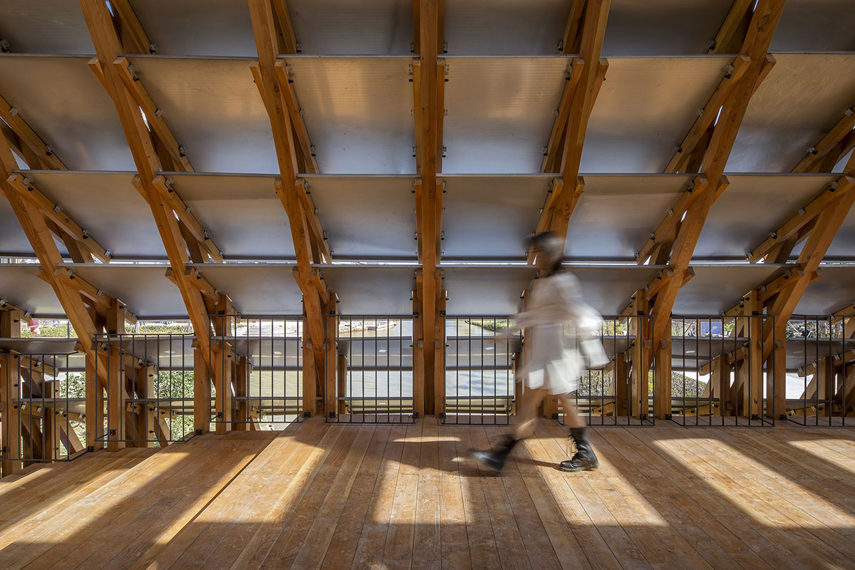 Arched timber bridge by LUO studio allows boats to pass under bridge smoothly in Gulou waterfront