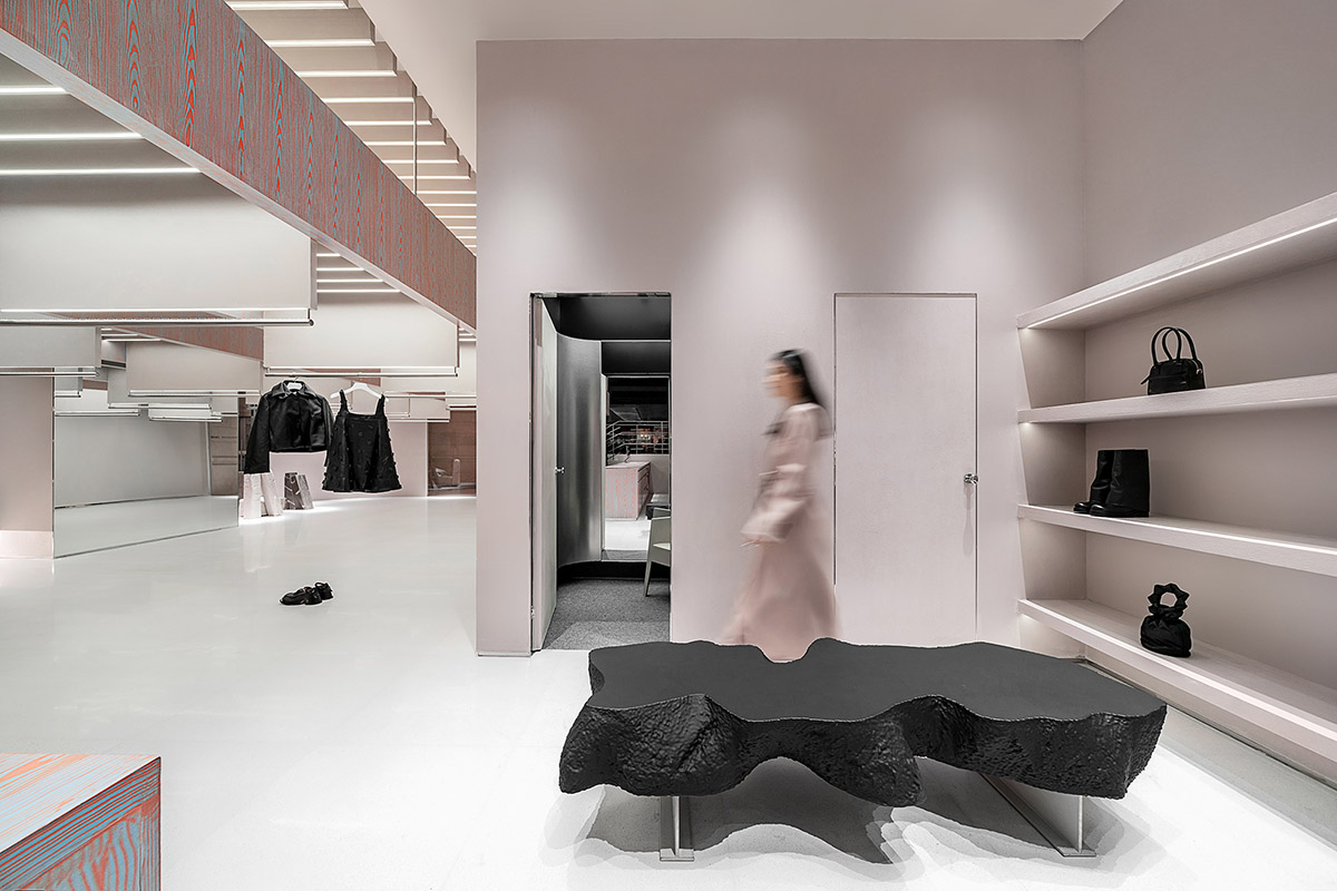 Various Associates creates show-like and pink-hued fashion store under a viaduct in Chongqing