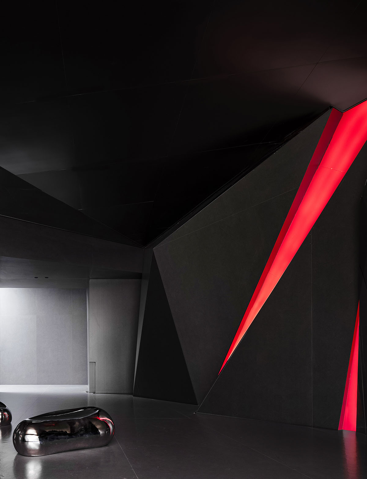 Exhibition hall interiors feature sharp angles and surfaces addressing diamond cutting processes