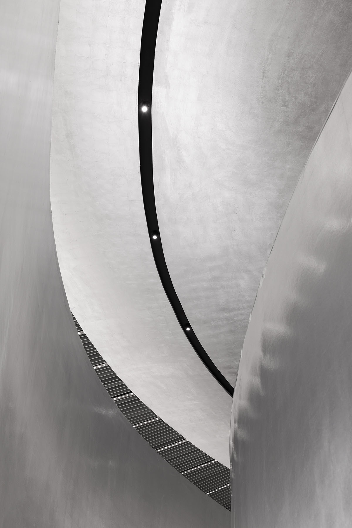 Various Associates designs beauty store with winding staircase and silver-toned interiors in Hangzhou