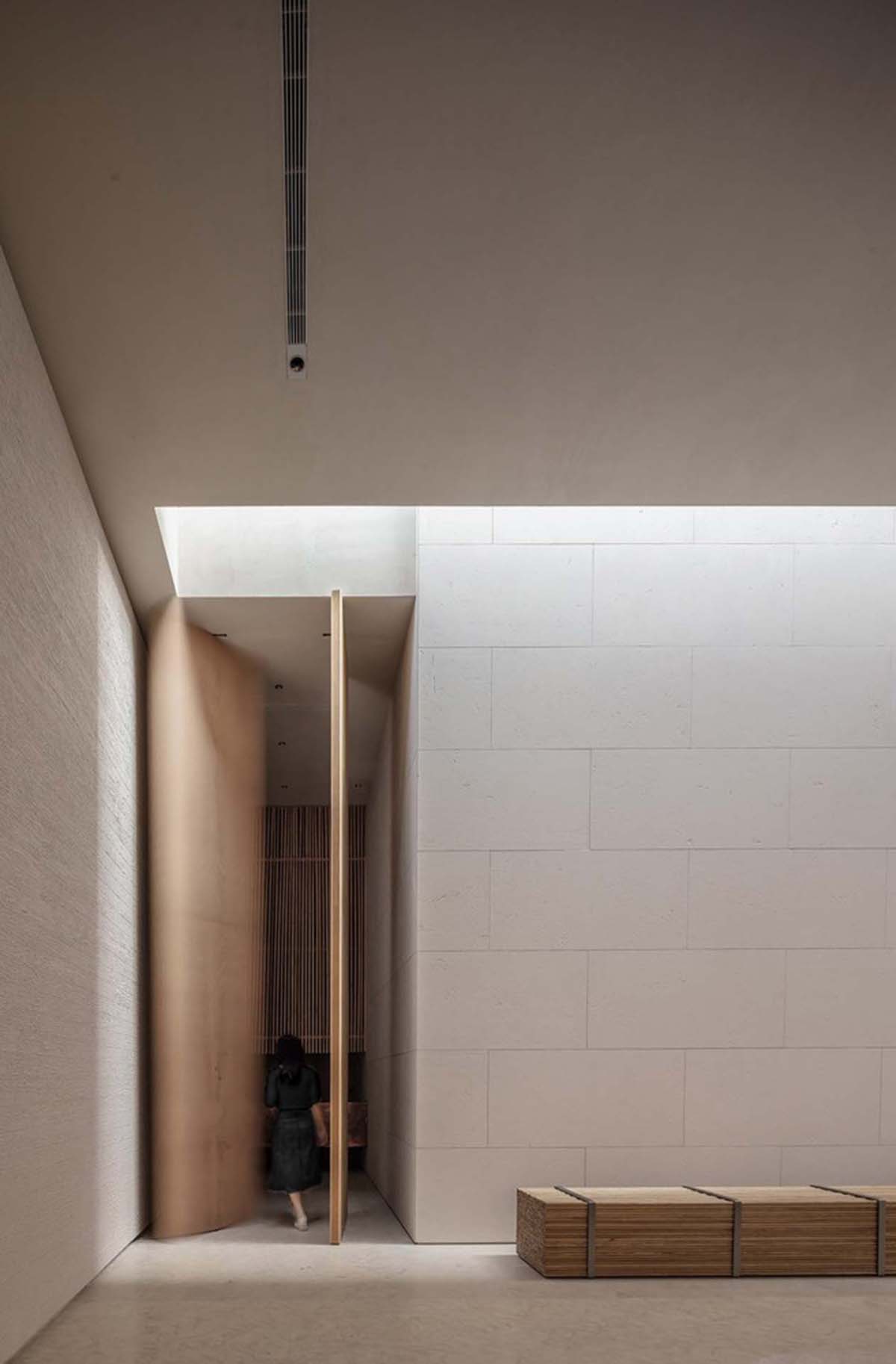 Waterfrom Design creates peaceful interior with wooden furnitures for tea community center in China