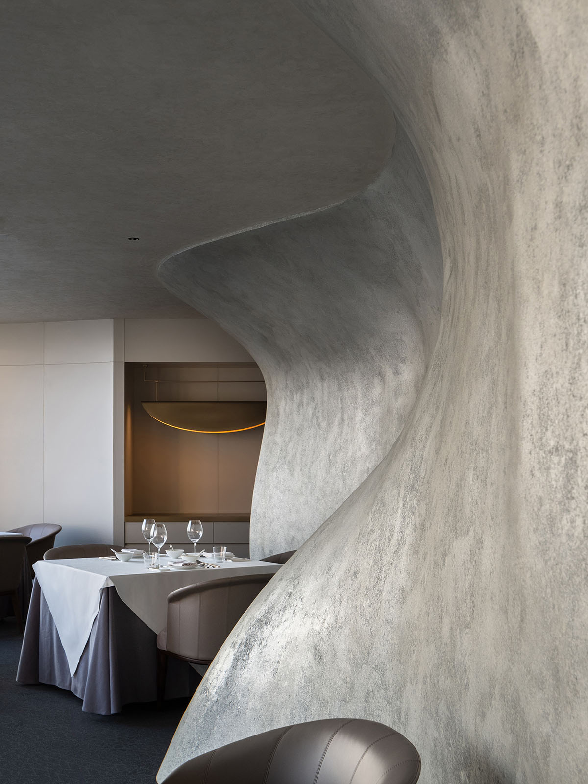 Nature Times Art Design completes restaurant with cave-like wall and garden-themed hall in Hangzhou