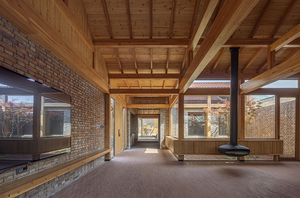 Archstudio renovates Beijing's old courtyard house with new wooden additions 