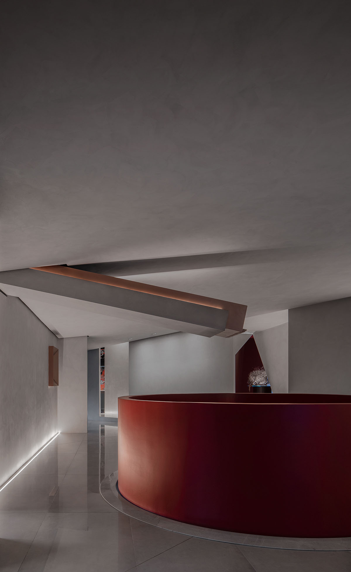 Masanori Designs' interiors include red cylinder bringing rainwater into the space