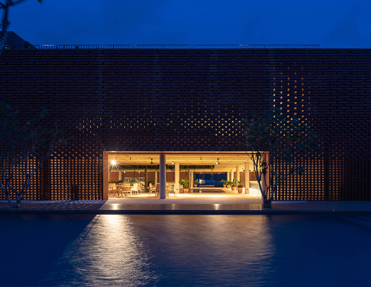 Wyndham Clubhouse by MIA Design Studio is built from bare brick layers to look like a lantern 