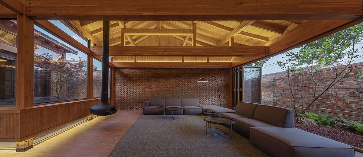 Archstudio renovates Beijing's old courtyard house with new wooden additions 