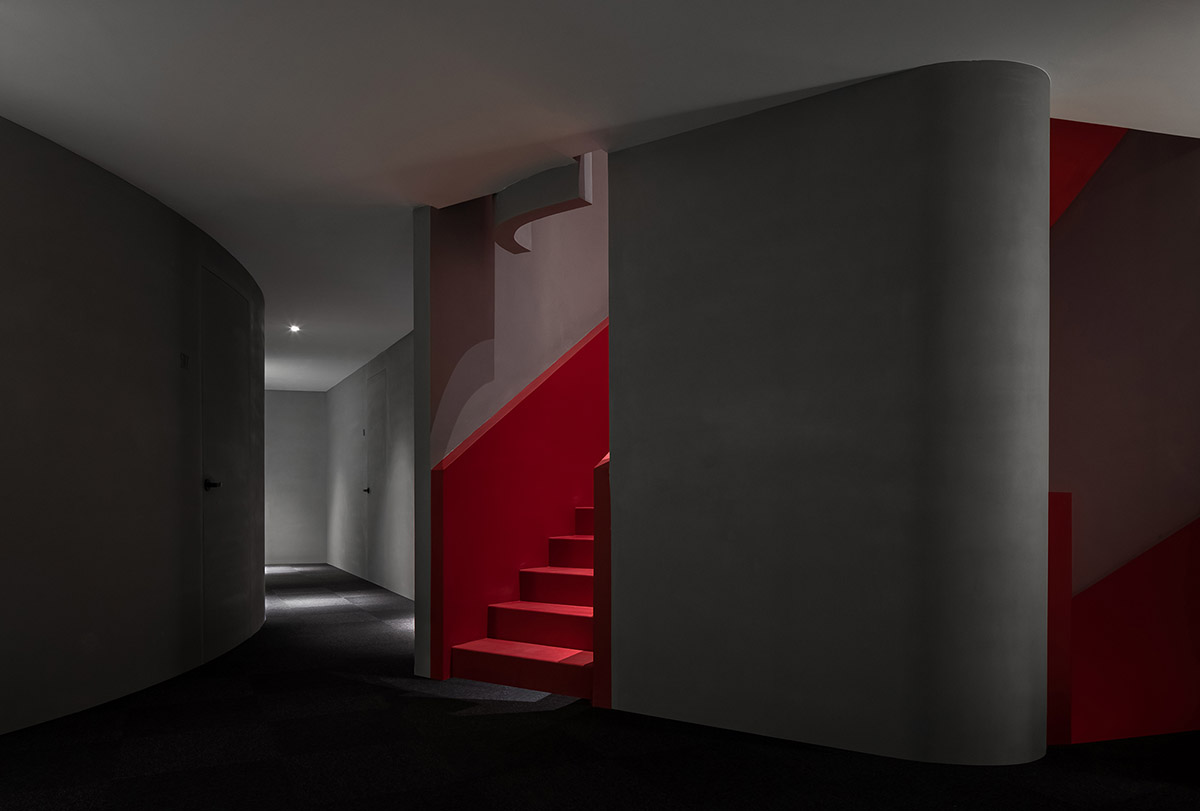 A beauty salon by AD ARCHITECTURE features dark-hued interiors drawing inspiration from cells