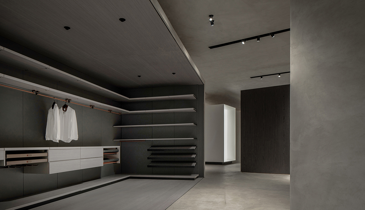 JST ARCHITECTURE creates dark-colored palette by adding a geometrical aesthetic to this showroom