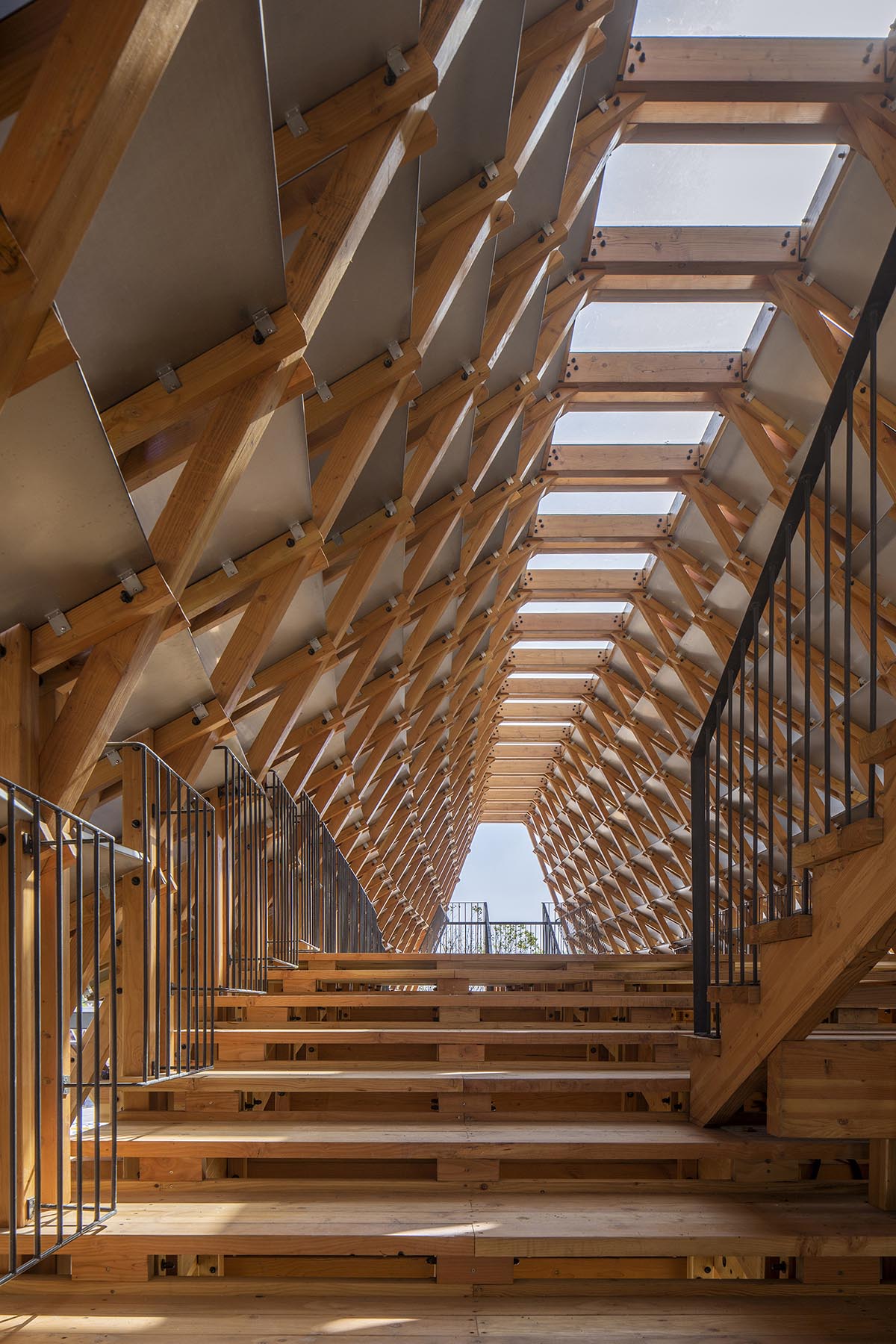 Arched timber bridge by LUO studio allows boats to pass under bridge smoothly in Gulou waterfront
