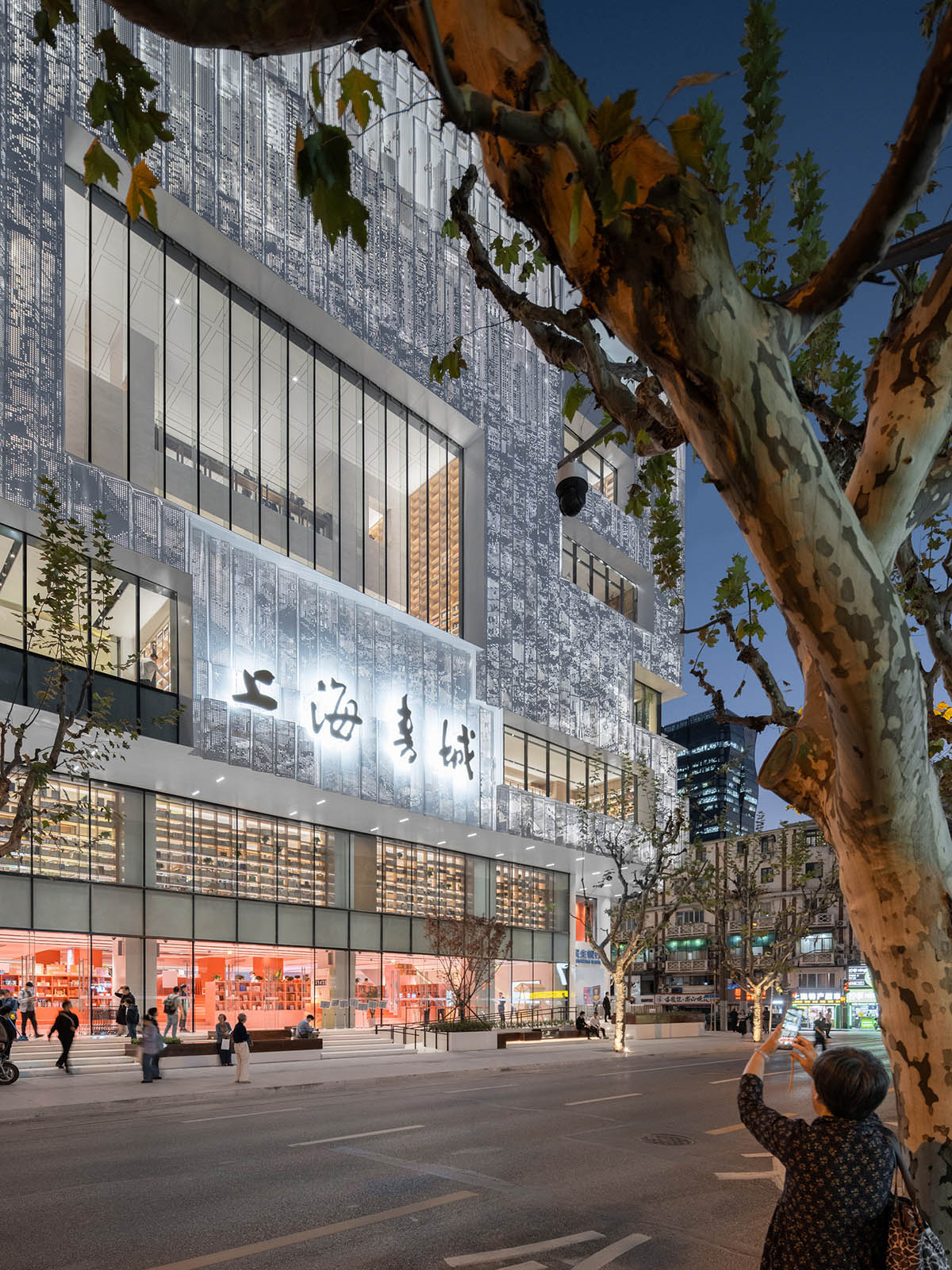 Shanghai Book City by Wutopia Lab clad in perforated metal panels giving a dazzling effect