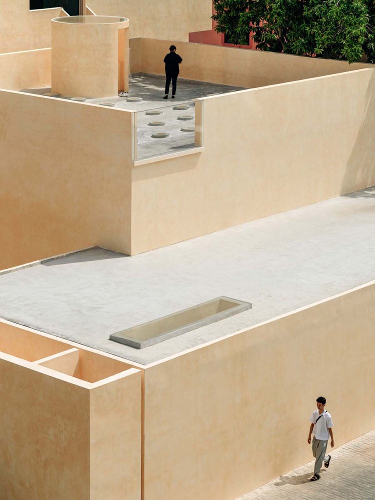 Ladder-Like sandalwood yellow volumes form Buddha artist's exhibition space and studio in China