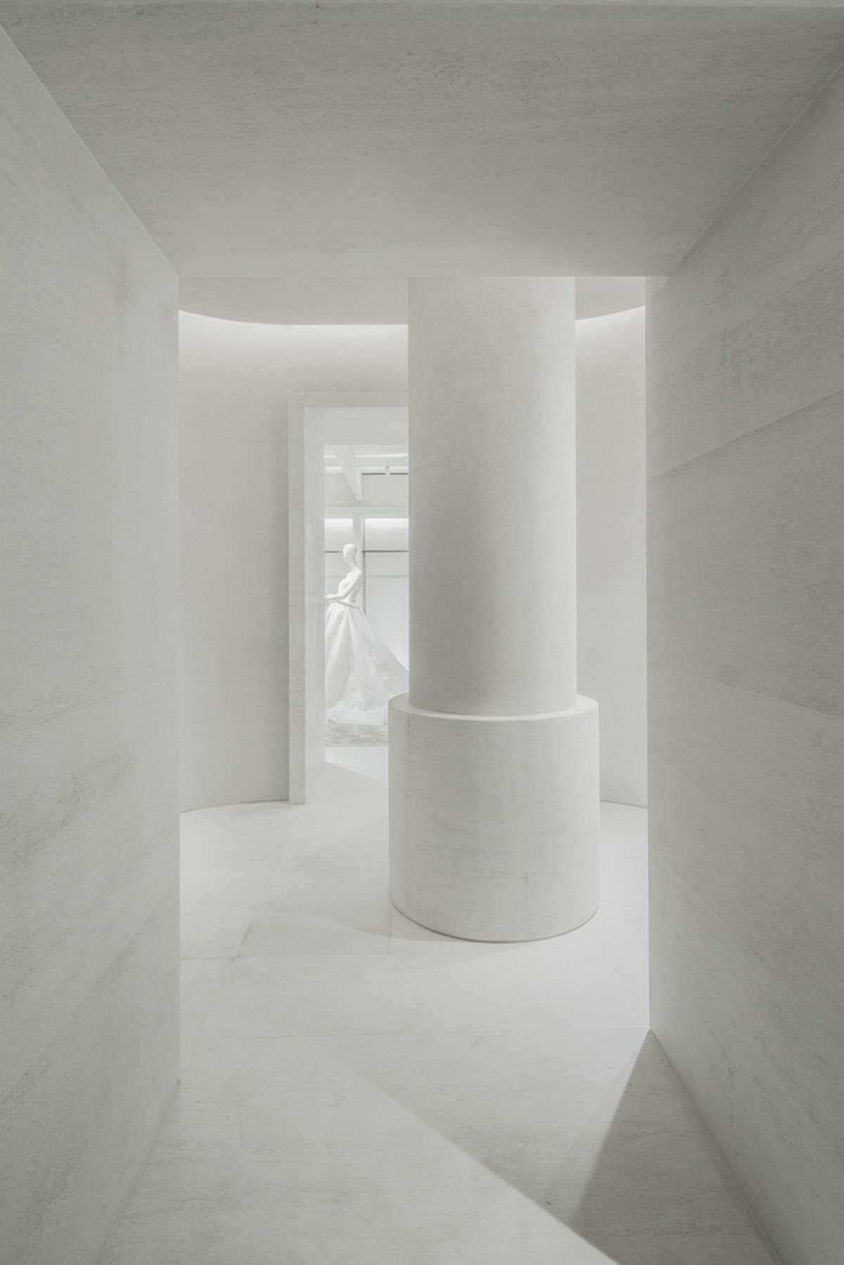 Atelier tao+c combines bright interior with black-framed showcase rooms for flagship store in China