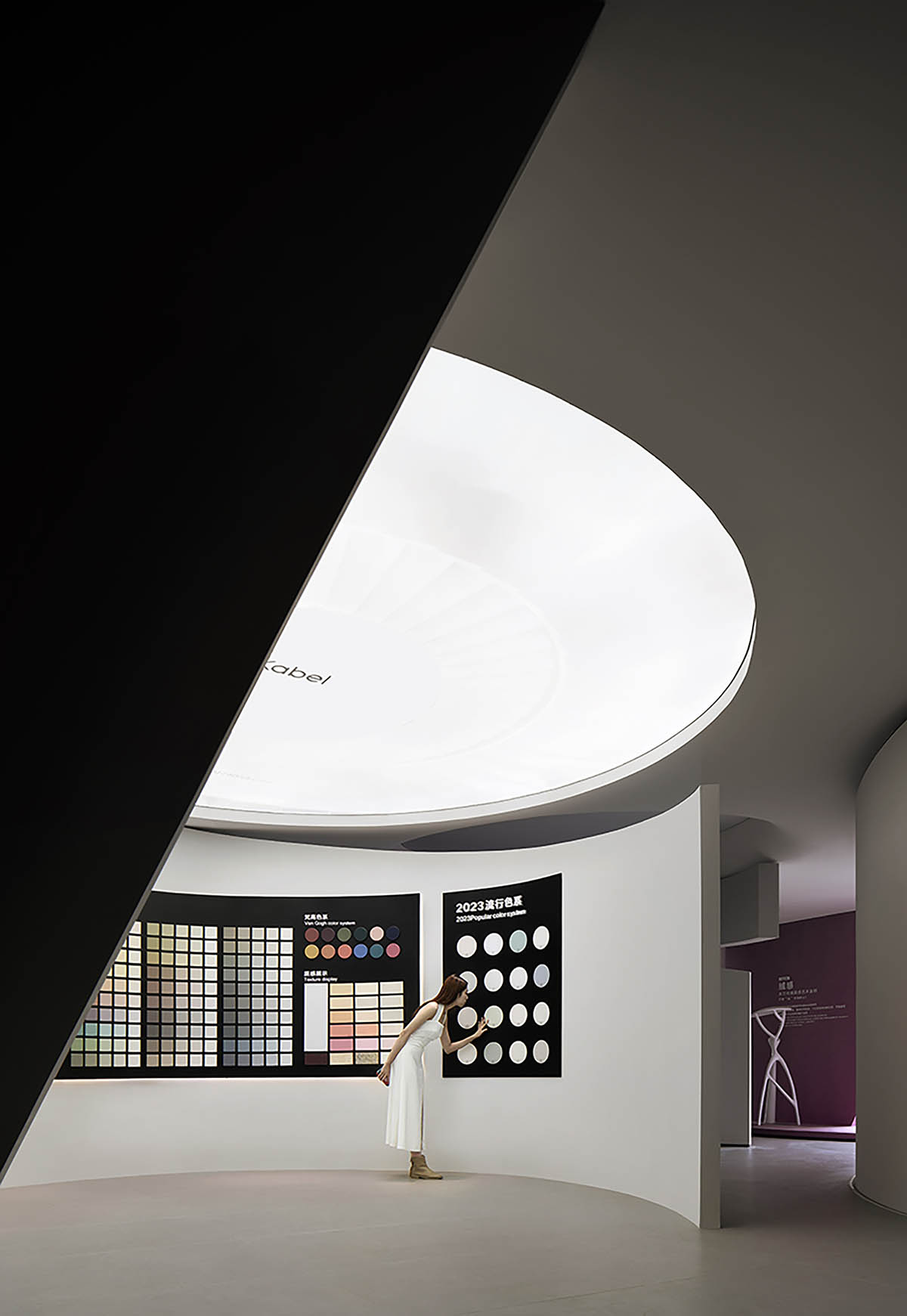 Exhibition hall interiors in China feature unconstrained flowing wall evoking