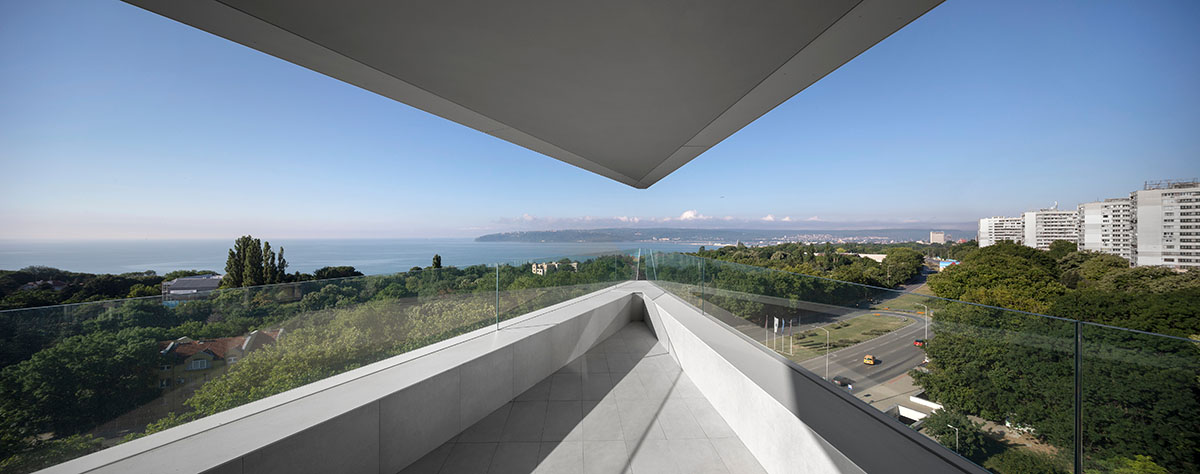 Sharp triangular balconies define this residential block designed by STARH in Bulgaria