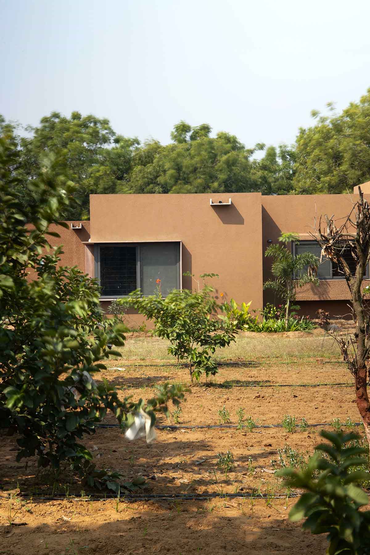 Farmhouse by Studio DesignSeed becomes a natural extension of its surroundings on Indian hills