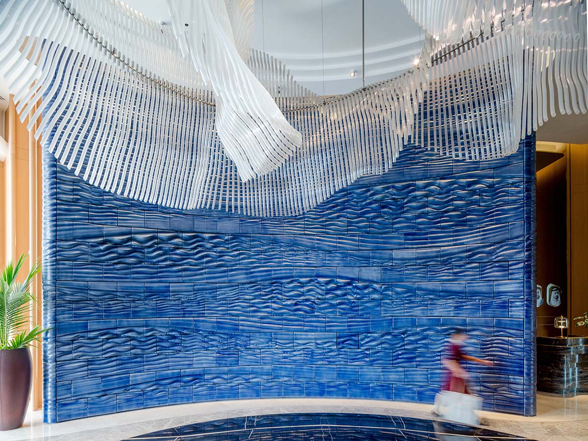 Studio RAP wraps the entrance of a hotel with majestic 3D printed ceramic walls 