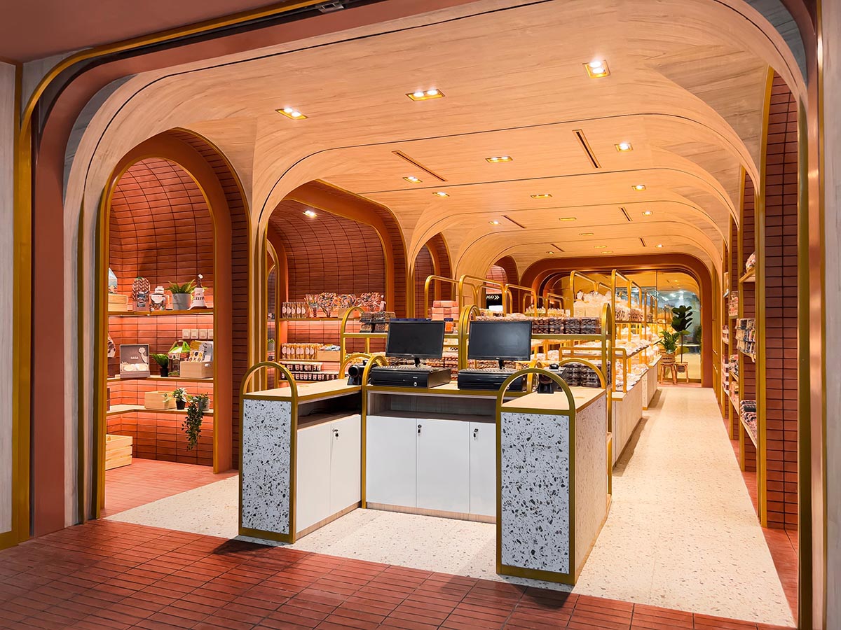 Bakery interior mimics arches and portals with bright red bricks in Papua, Indonesia 