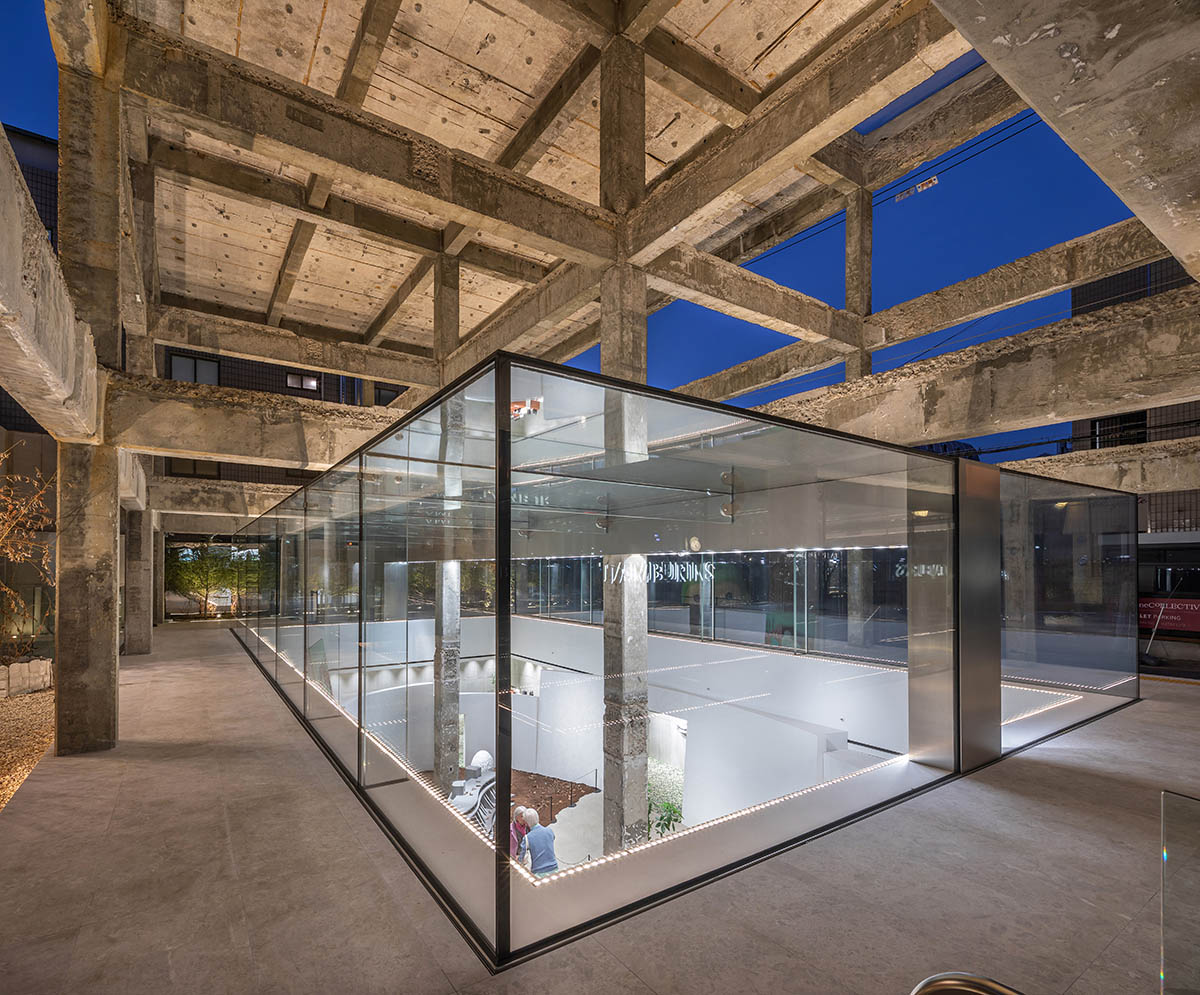 Perfume store by The System Lab shows the beauty of scent with gridded concrete and glass box
