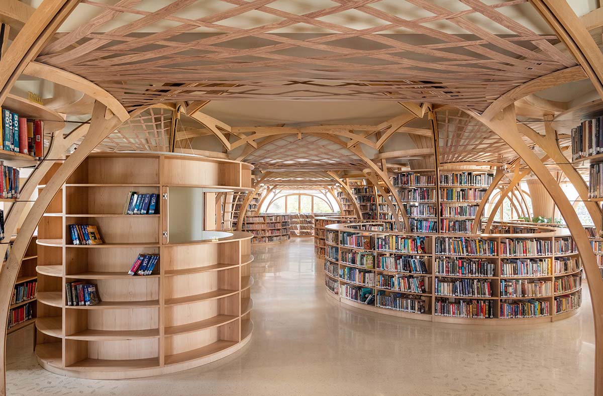 studio Hinge embeds a library under the wooden tree-like canopies in Mumbai