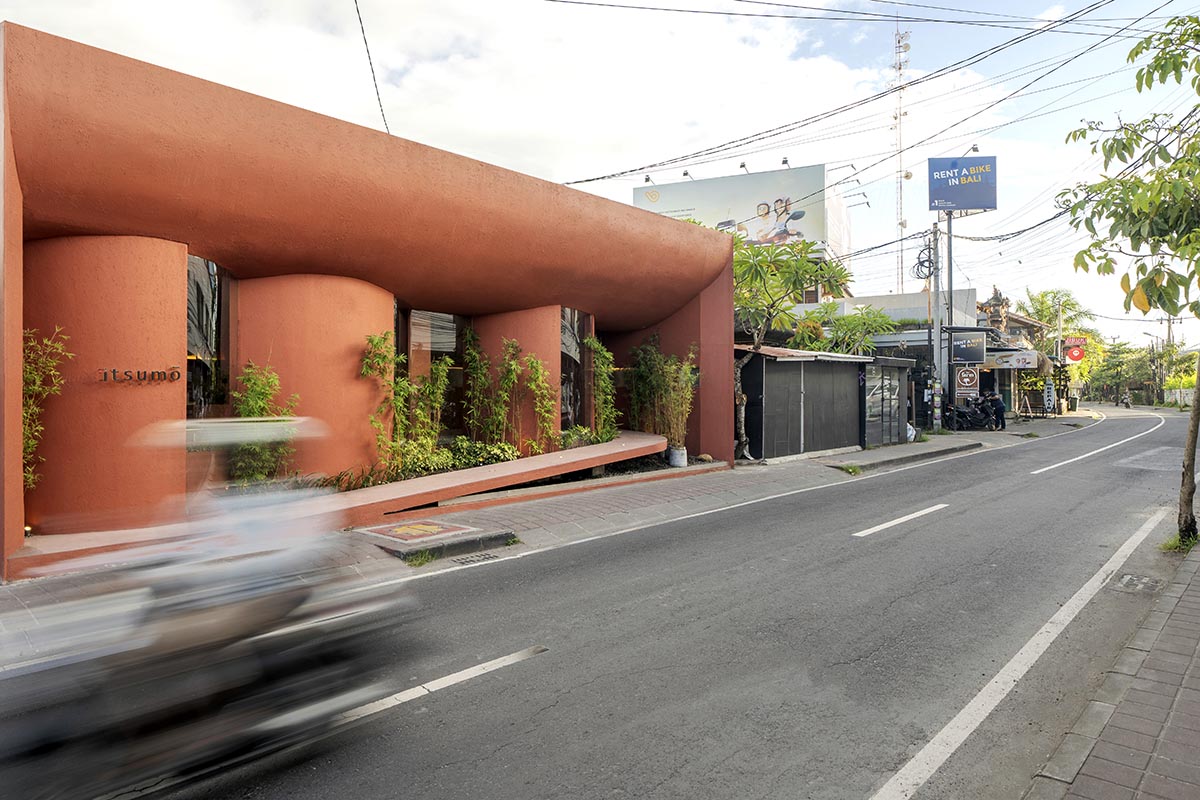 Arti Design Studio creates red arched walls to provide different seating experience in Indonesia 