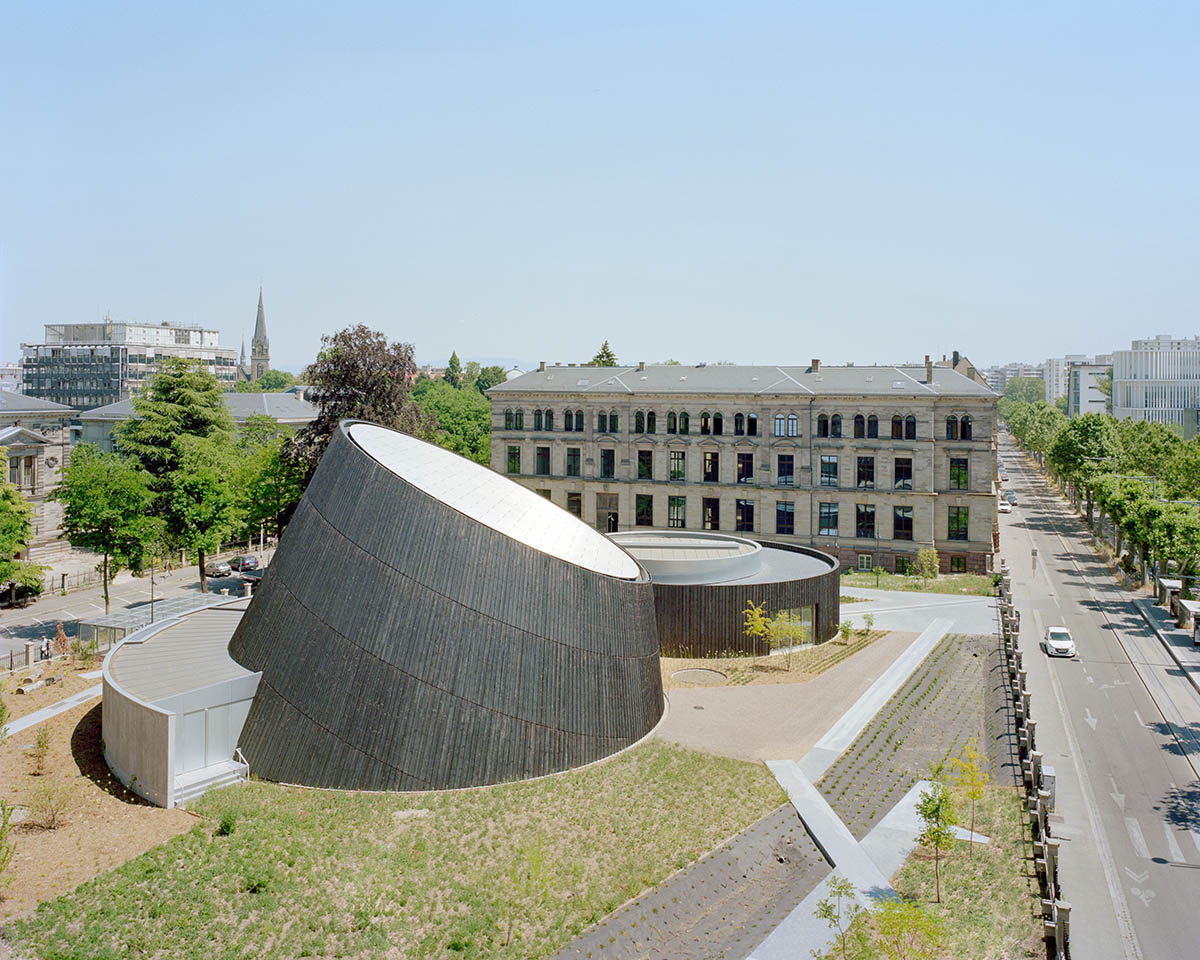 Planetarium clad in burnt wood at Université de Strasbourg evokes 19th century machine buildings
