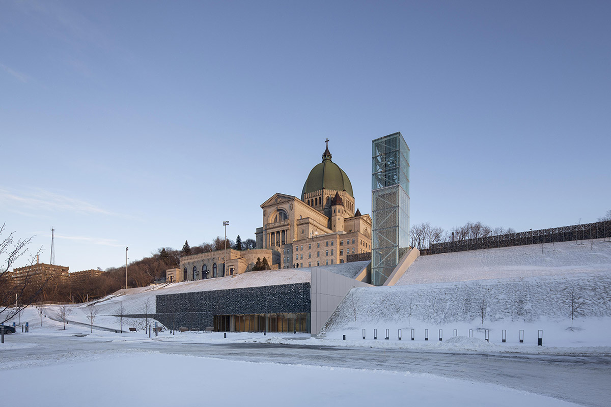 A striking bell tower pierces the sky, illuminating the grandeur of the pavilion in Montreal