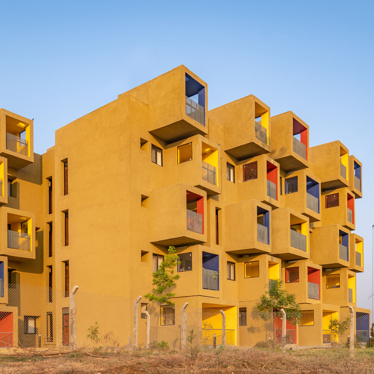 Sanjay Puri Architects designs residential building with colorful cuboid terraces in India