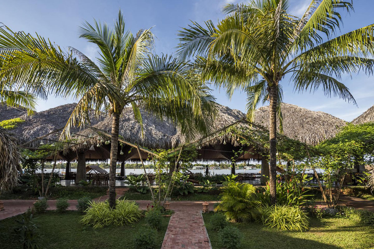 DDconcept Architecture uses coconut leaves and bamboo to create undulating restaurant in Vietnam