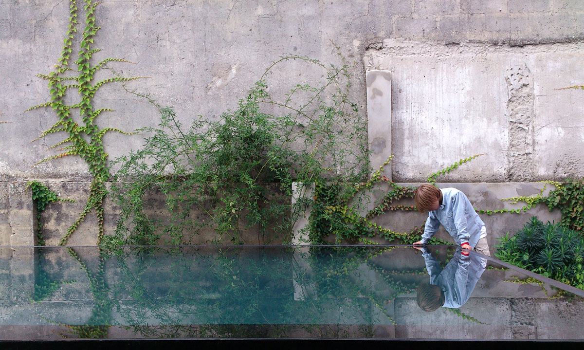 Extrastudio converted former winery in Portugal  into a new family home with red mortar walls