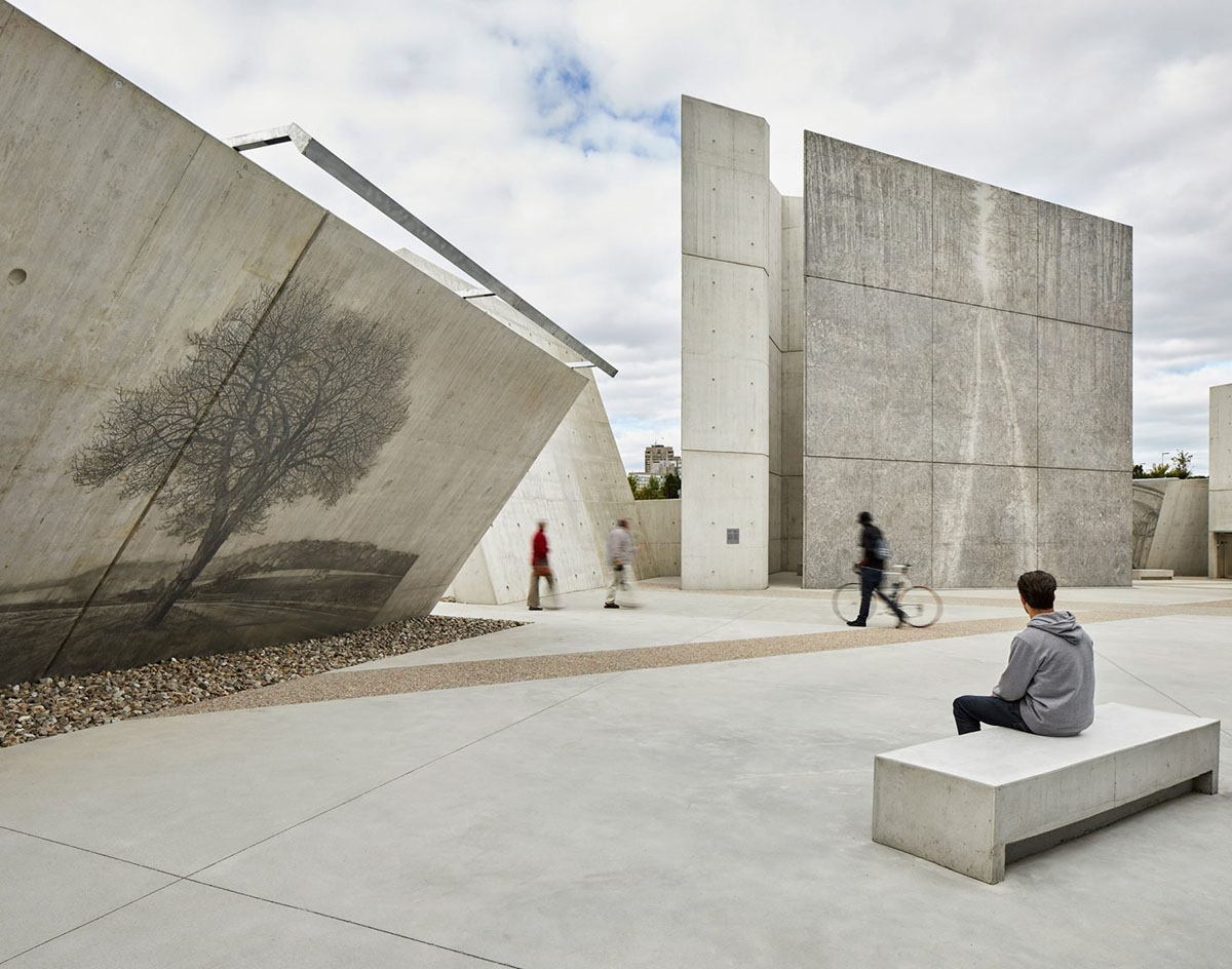 Daniel Libeskind’s Holocaust Monument features fragmented concrete walls creating rough landscape