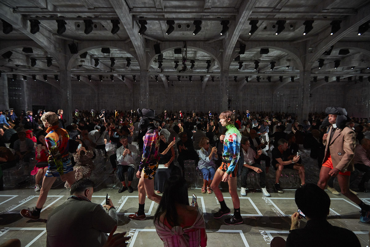 AMO filled Prada's fashion show stage with purple-lit inflatable stools