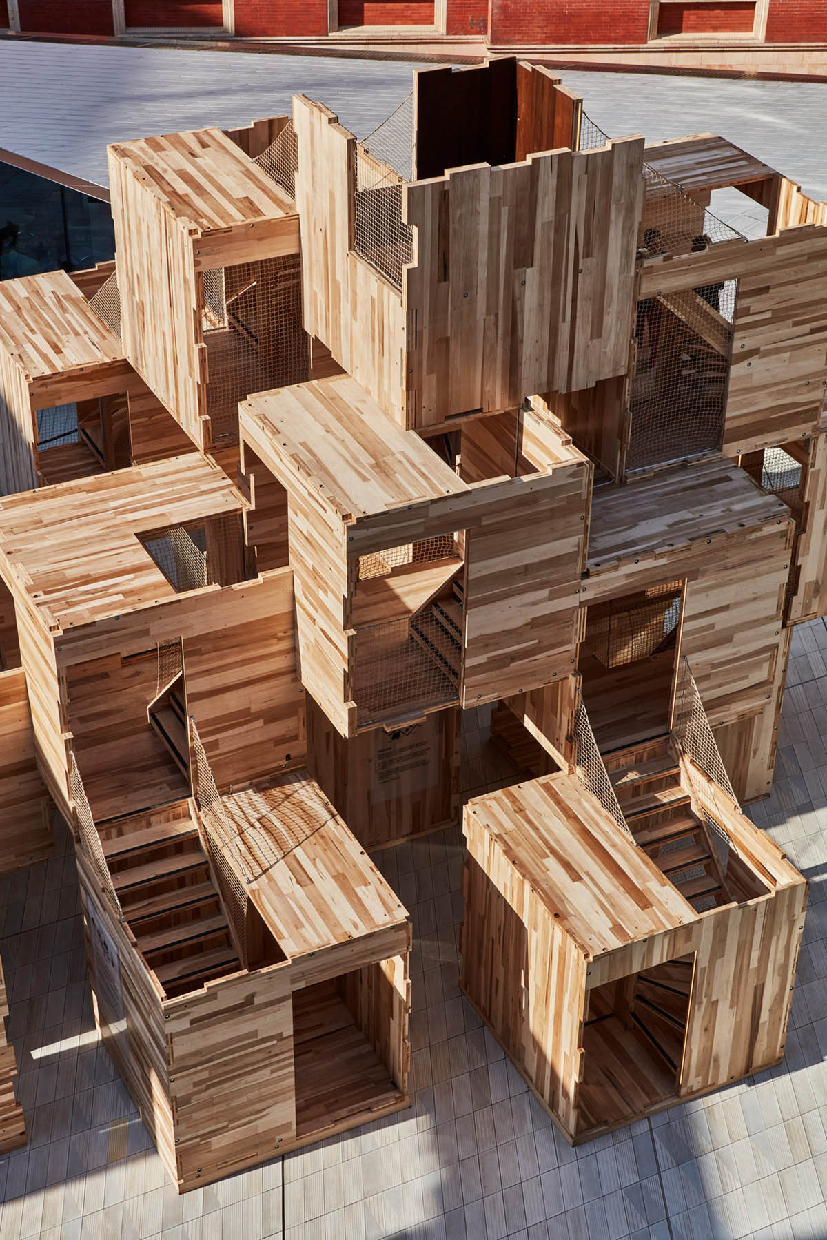Waugh Thistleton Architects installs modular wooden maze-like sculpture at London Design Festival