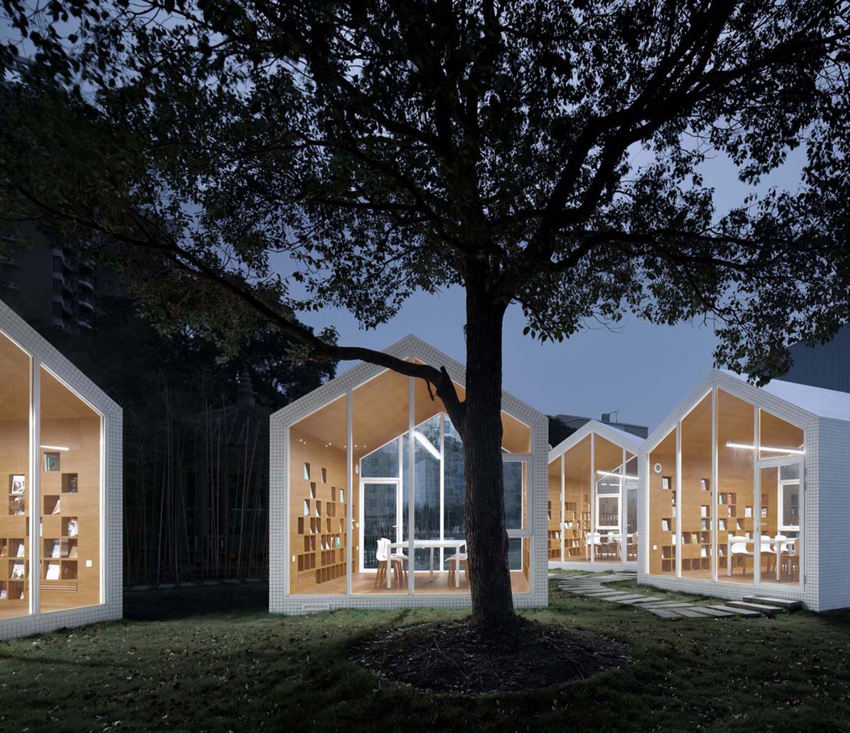 Four mini cabins by Yuan Architects scattered in a forest to create a reading village in Taizhou City