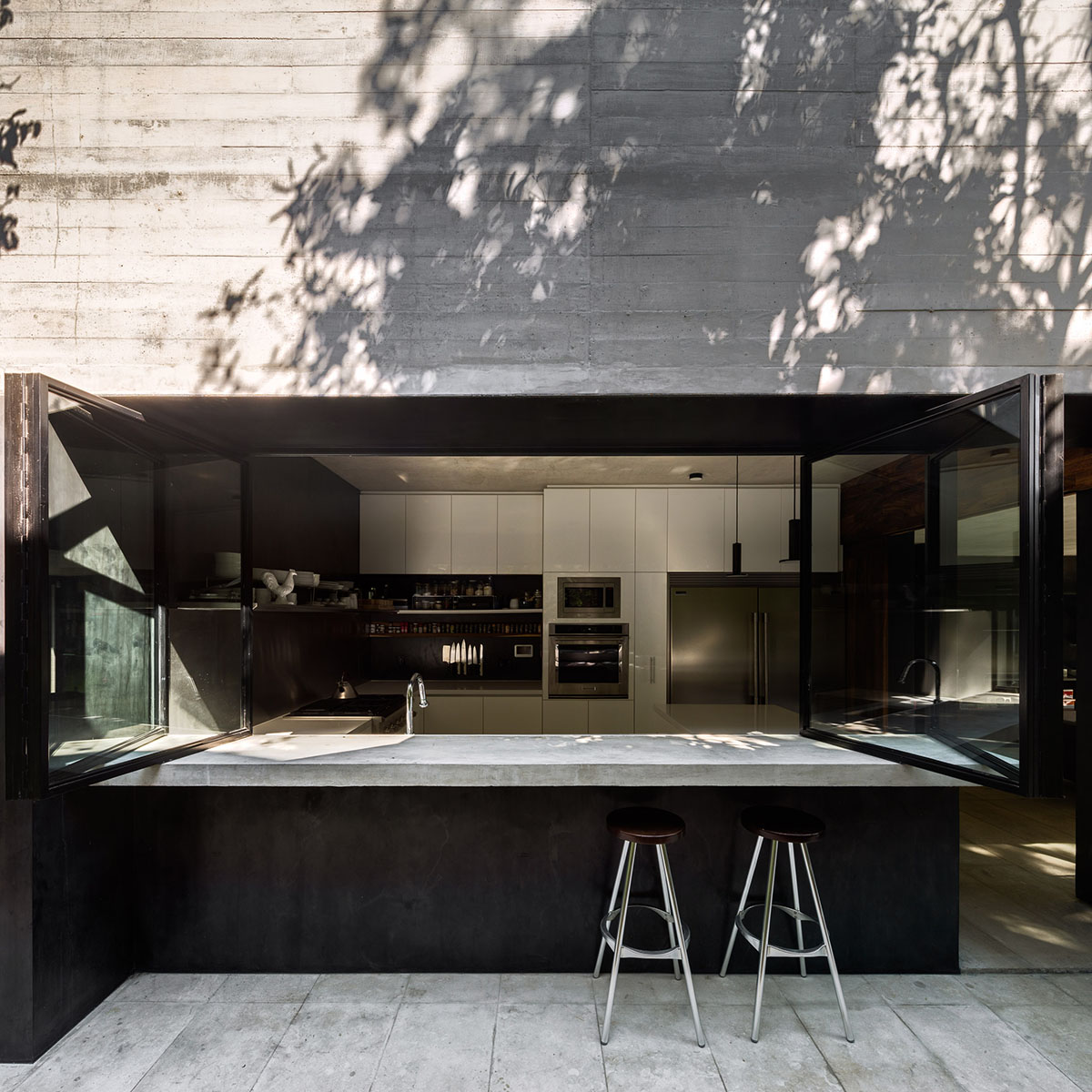 PPAA Arquitectos built compact concrete house with large private terrace in Mexico City