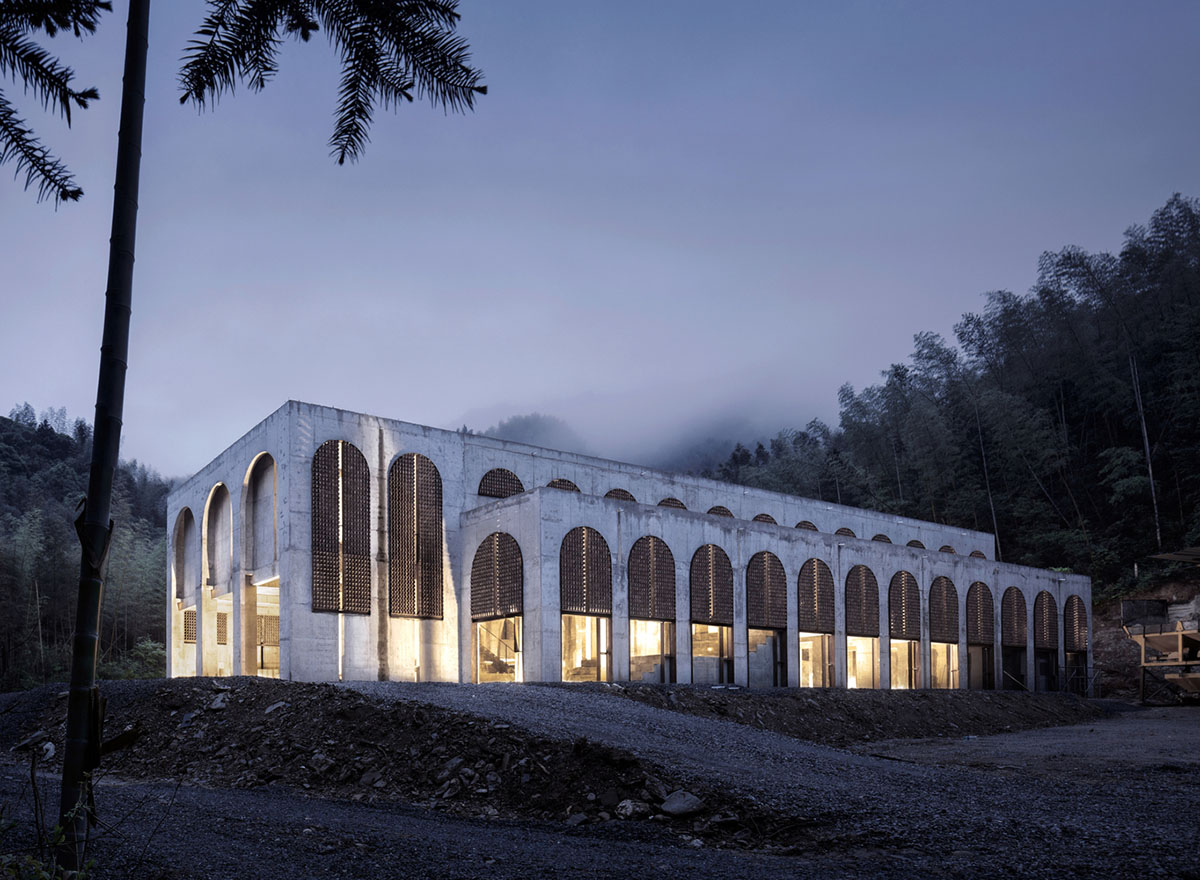 AZL Architects renovates old kiln building with concrete and brick arches in the middle of a forest