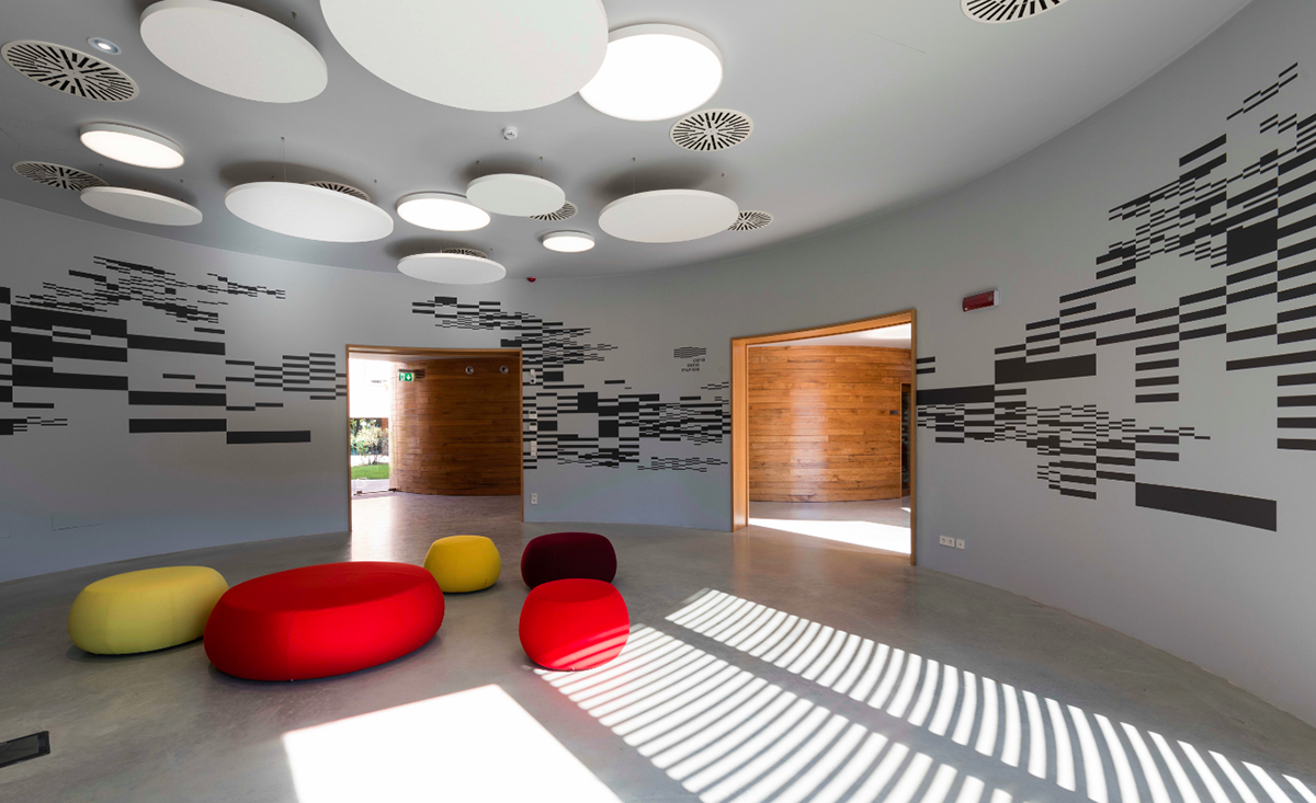 Nine wooden circular music boxes by MCA placed on the former Lamborghini manufacturing site in Italy