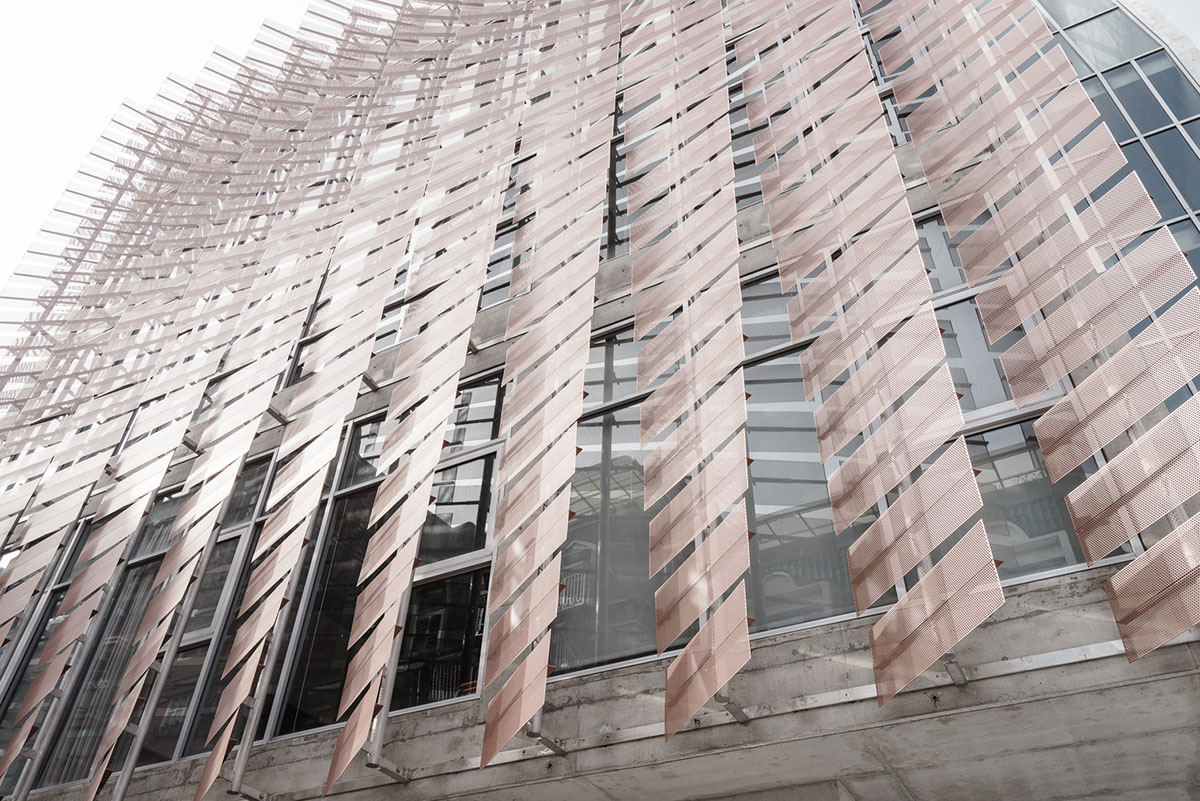 MAYU architects+ adds copper-coloured featherlike screen to main facade of Tung-Men Holiness Church