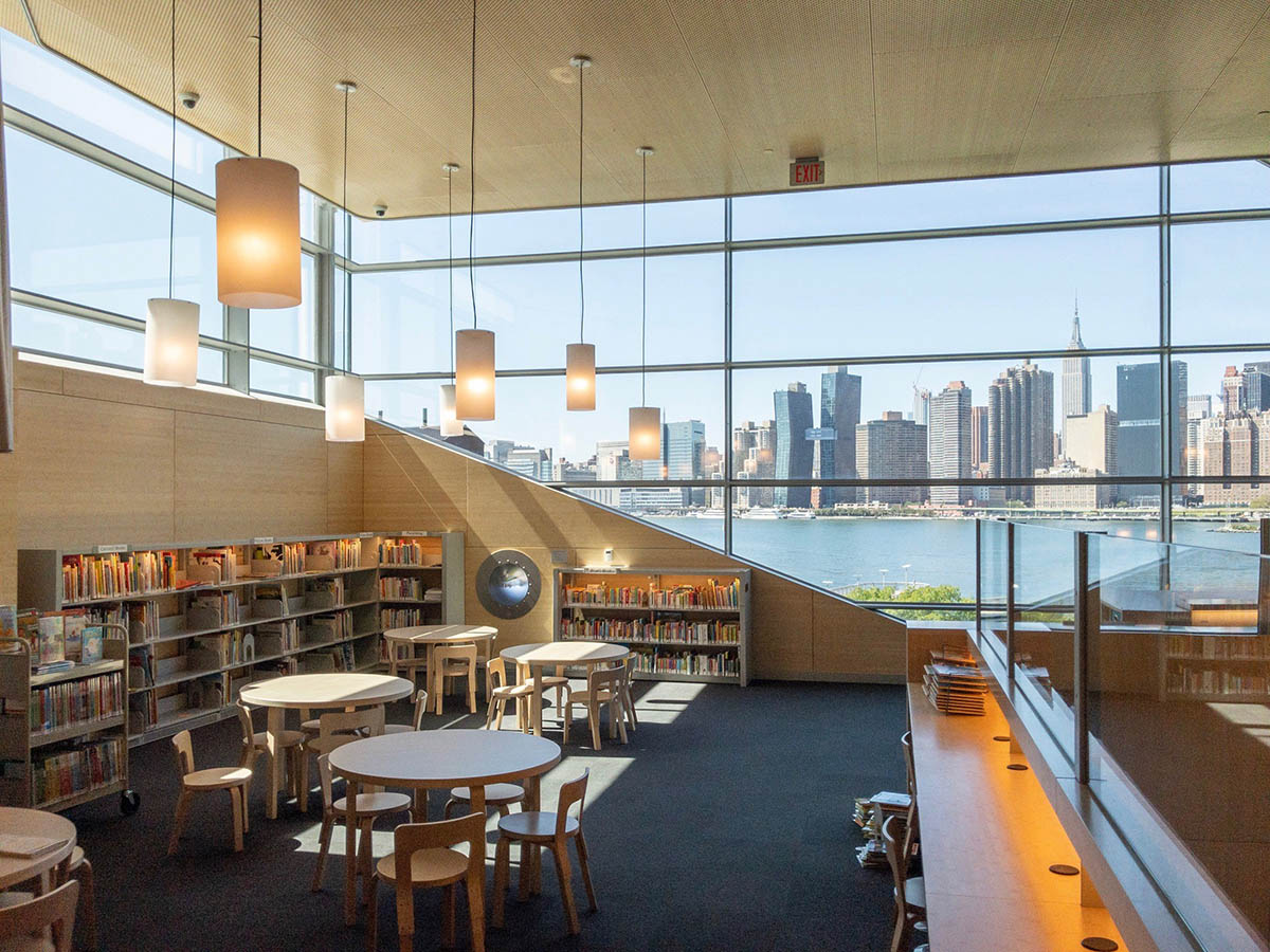 Steven Holl Architects completes Hunters Point Library with flowing sculpted cuts in New York