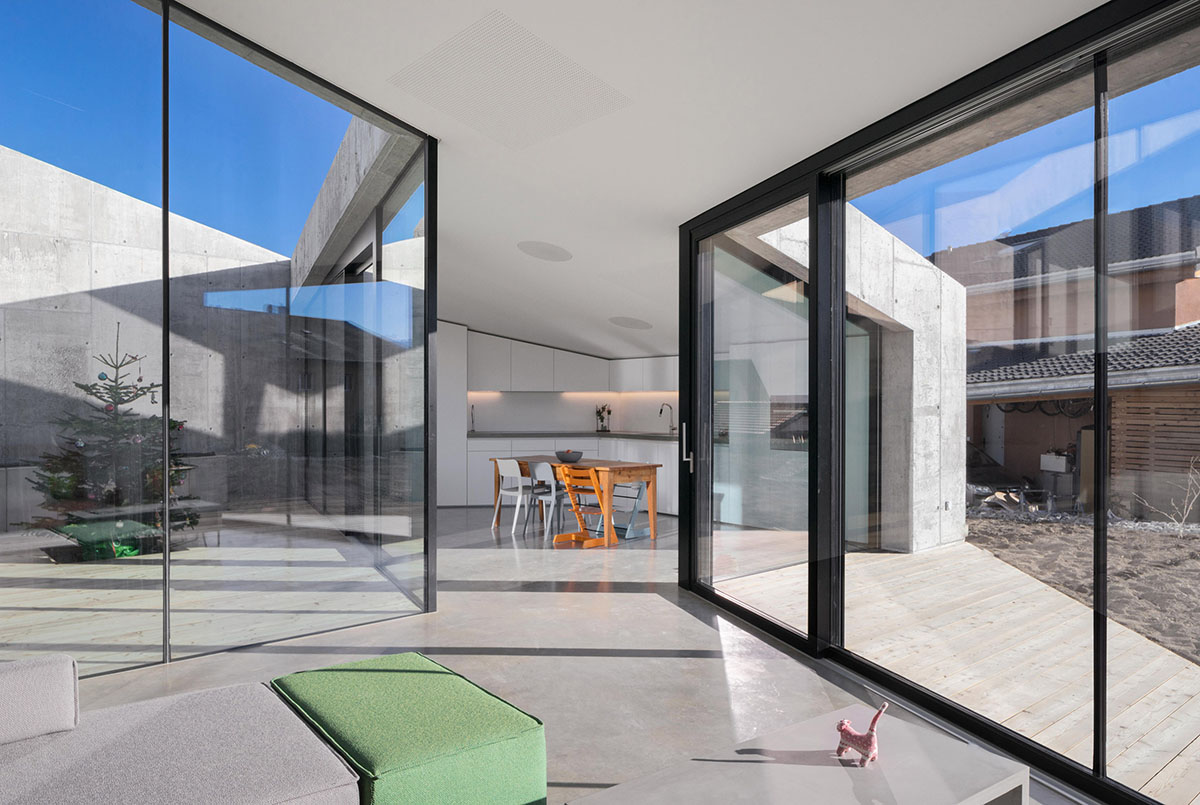 Anako Architecture completes slopped concrete residence in Switzerland