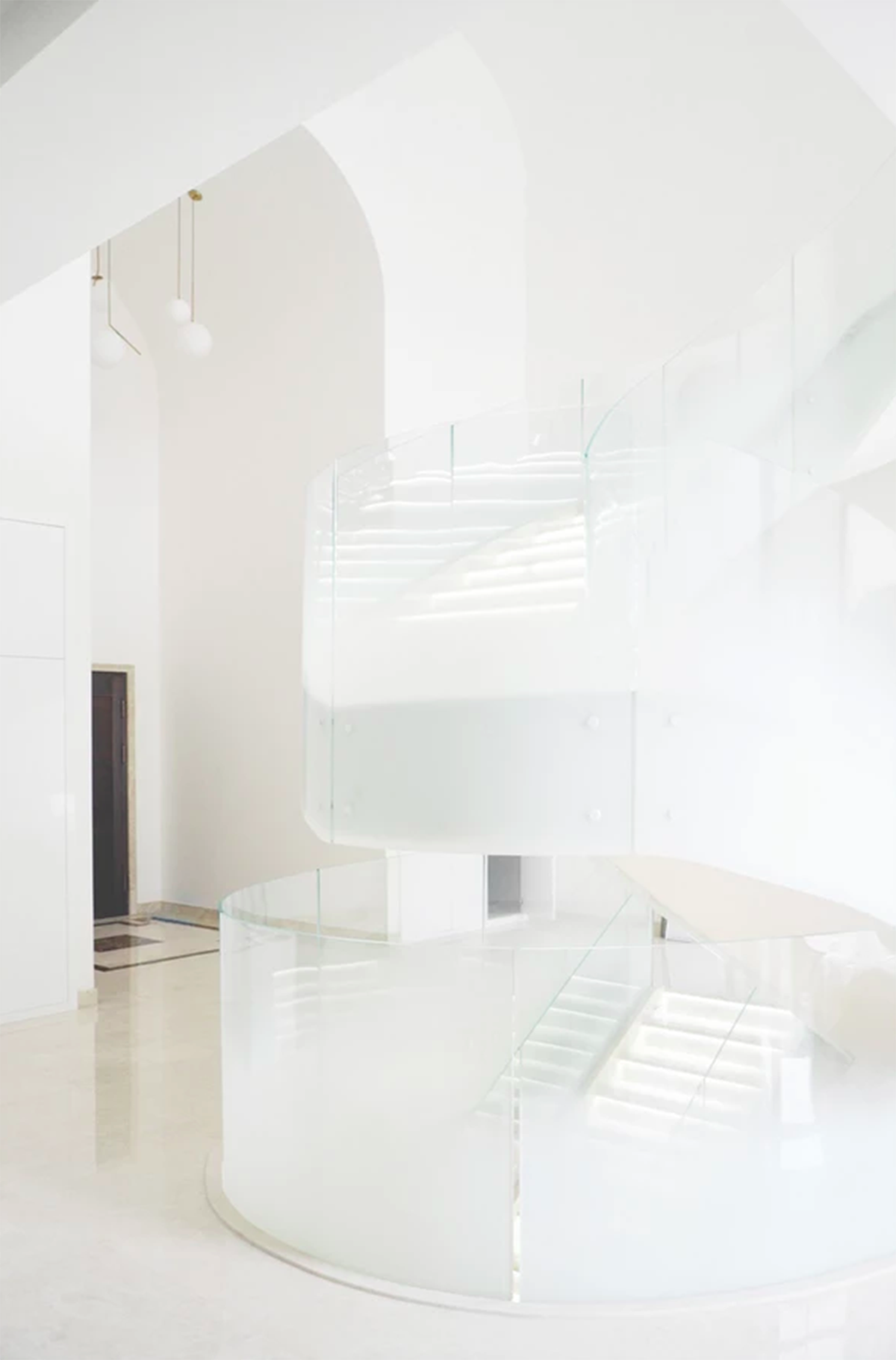 Grand spiral staircase dominates Cloud Villa in Shanghai by KOS Architects