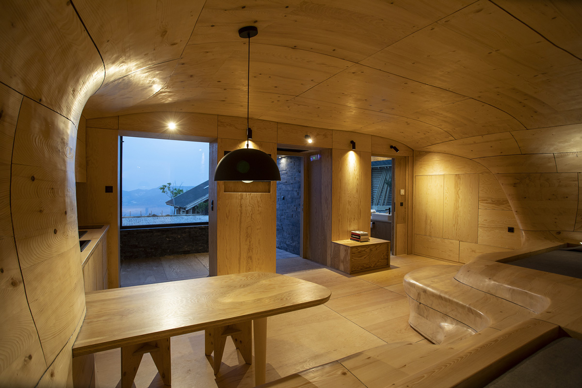 Tenon Architecture creates cave-like wooden interior for a resort in Greece