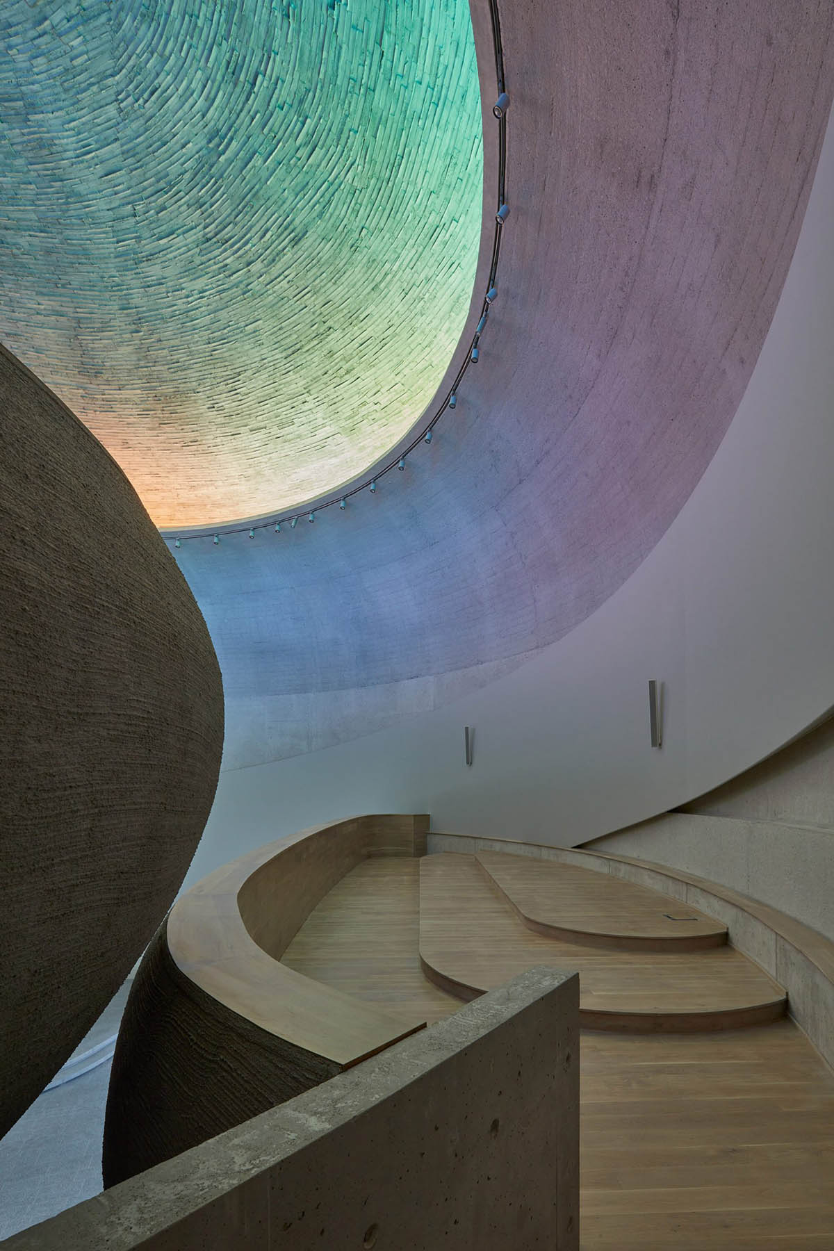 Atelier Štěpán designs Church of Beatified Restituta that features a circular rainbow window in Brno