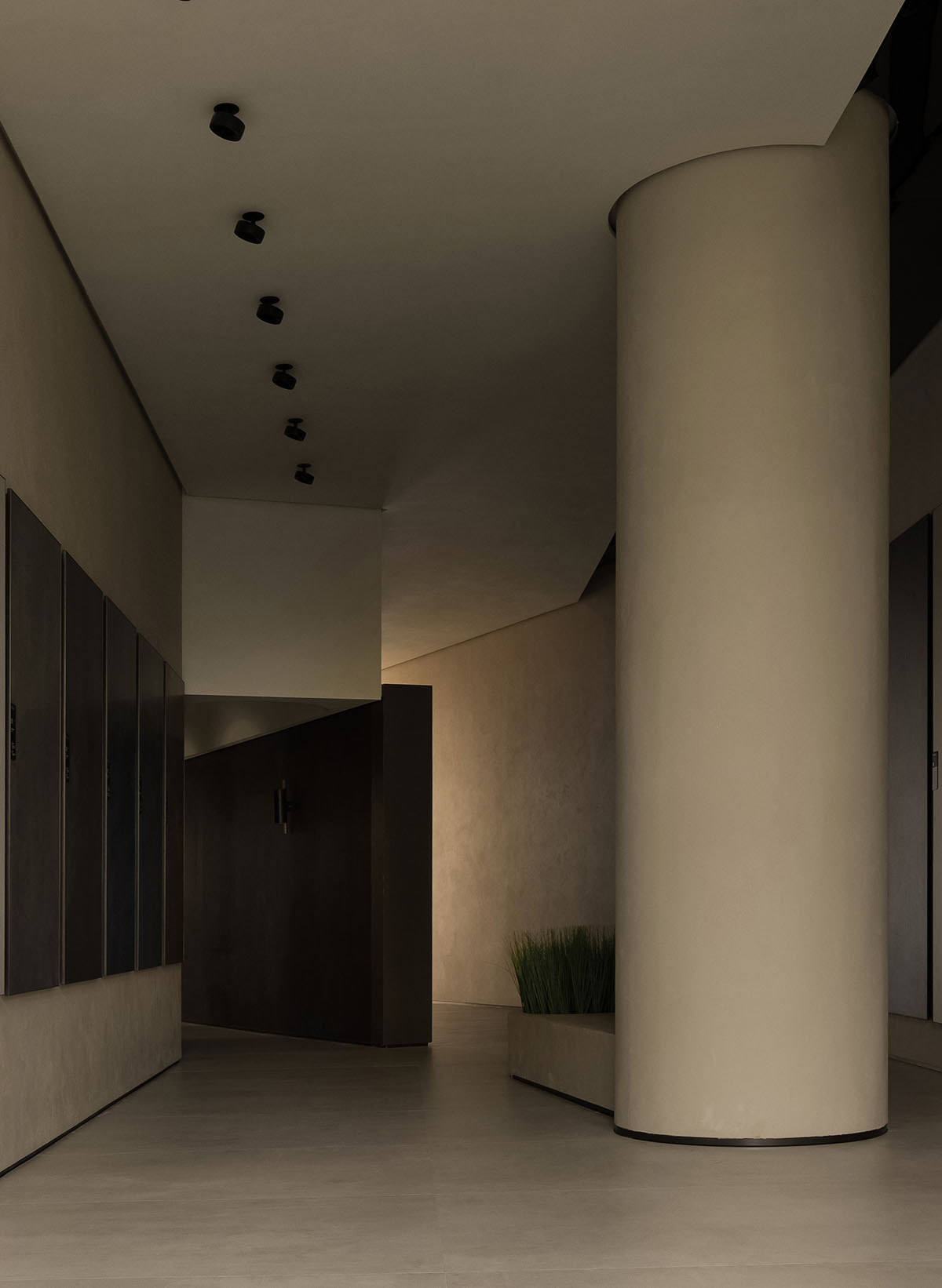 Curved walls and cave-like holes form I.T CERAMICHE Headquarters by Foshan Topway Design