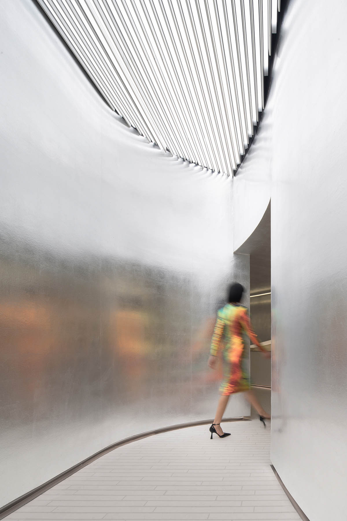 Various Associates designs beauty store with winding staircase and silver-toned interiors in Hangzhou