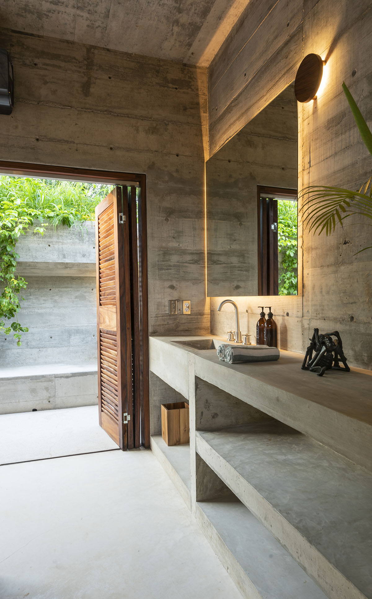 Casa TO by Ludwig Godefroy features an island of stairs and vaulted volumes to create discreet oasis