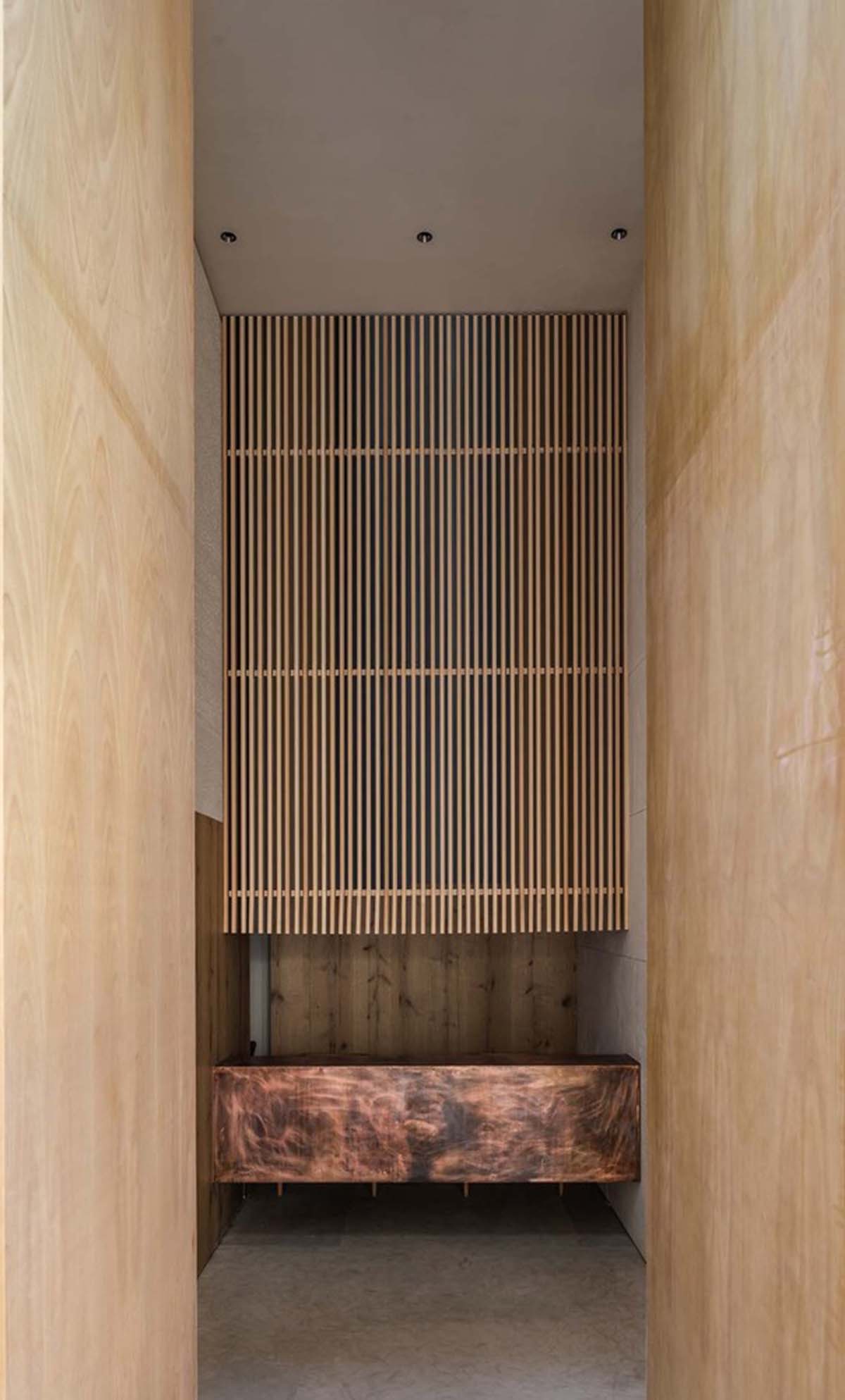 Waterfrom Design creates peaceful interior with wooden furnitures for tea community center in China