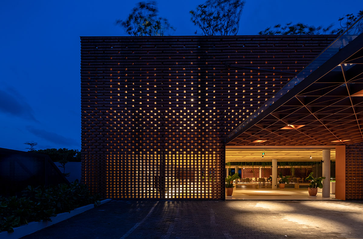 Wyndham Clubhouse by MIA Design Studio is built from bare brick layers to look like a lantern 