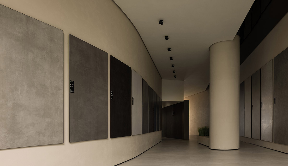 Curved walls and cave-like holes form I.T CERAMICHE Headquarters by Foshan Topway Design