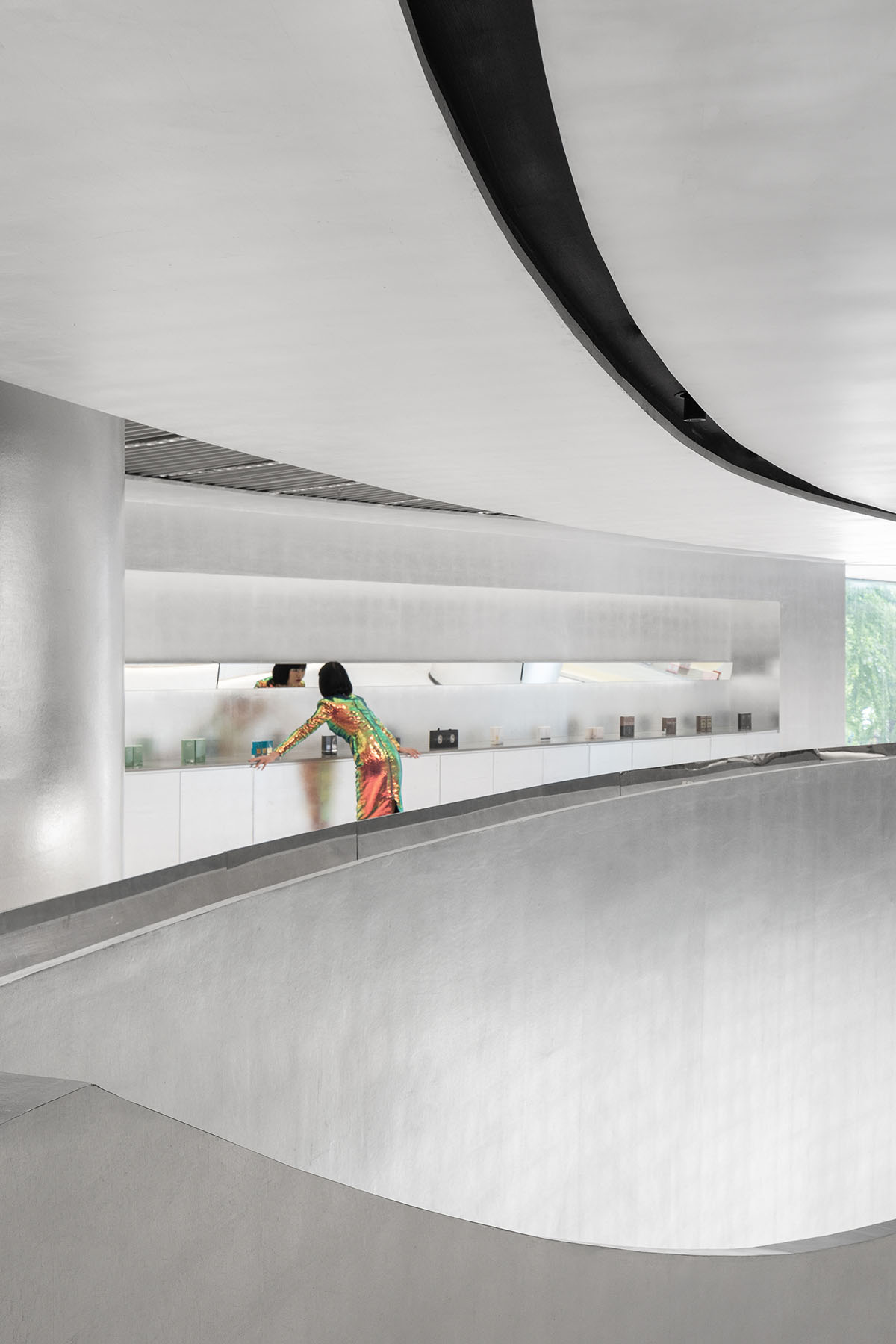 Various Associates designs beauty store with winding staircase and silver-toned interiors in Hangzhou