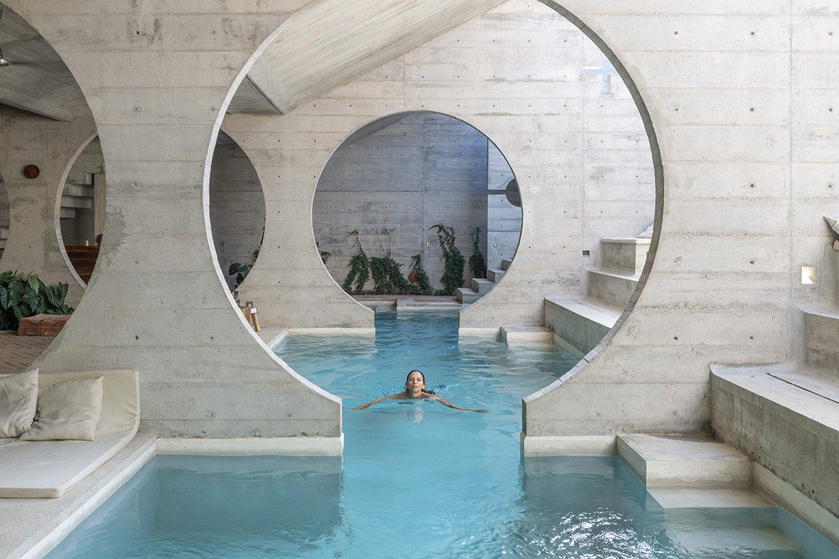 Casa TO by Ludwig Godefroy features an island of stairs and vaulted volumes to create discreet oasis